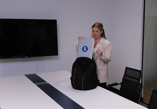 Person with Planet Depos laptop preparing for a deposition