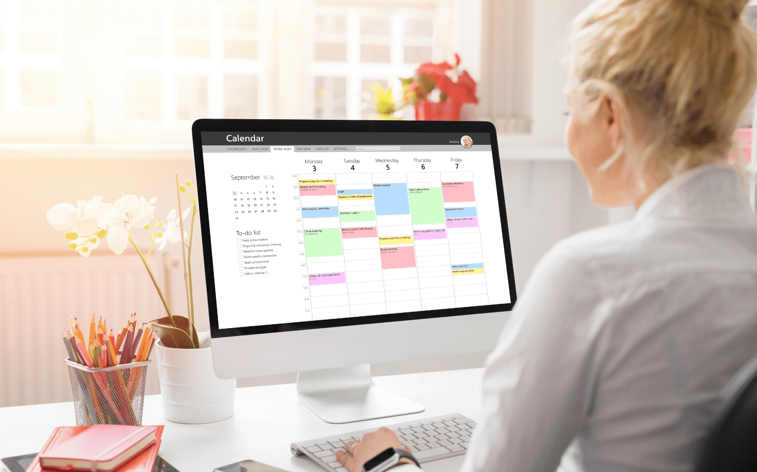 Attorney looking at court reporting schedule on desktop computer