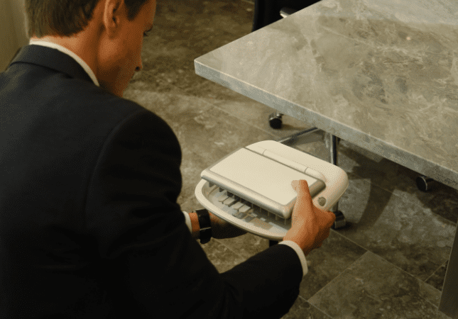 Court reporter setting up their steno machine
